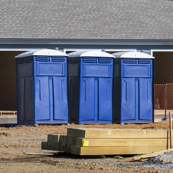 what is the cost difference between standard and deluxe portable restroom rentals in Carmichaels